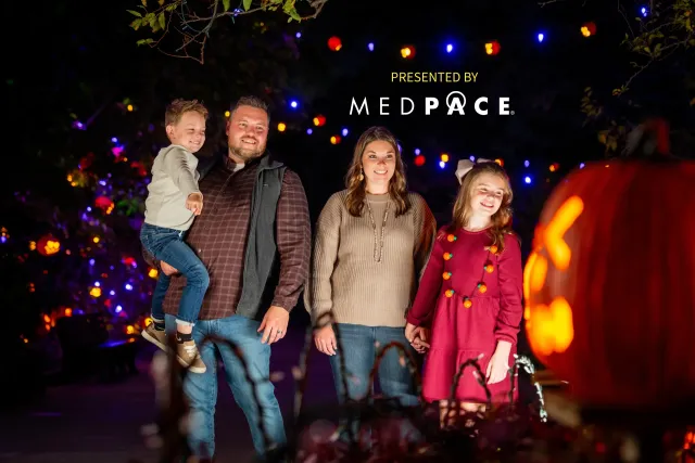 family looking at pumpkins at jack o lantern glow